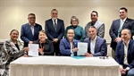 Navajo President Buu Nygren signs warranty deed to take land into trust along U.S. Highway 89 near Flagstaff